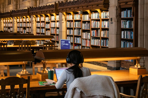 Student preparing for university study in a library
