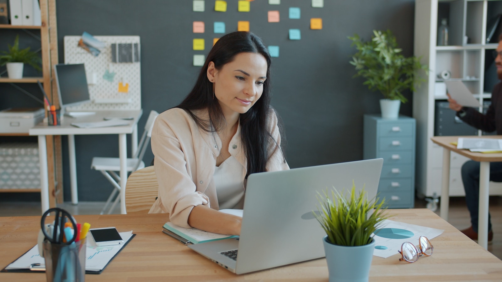 Professional working at a laptop in an office