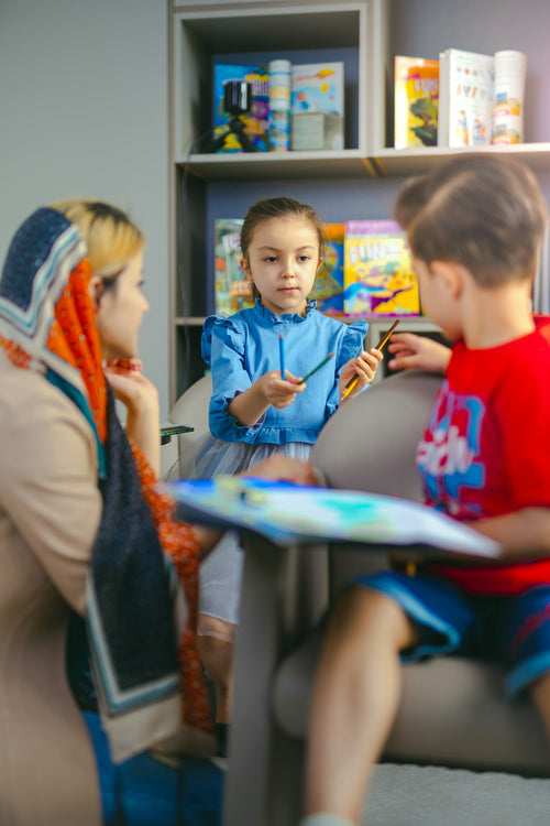 Primary school child receiving learning support in a classroom